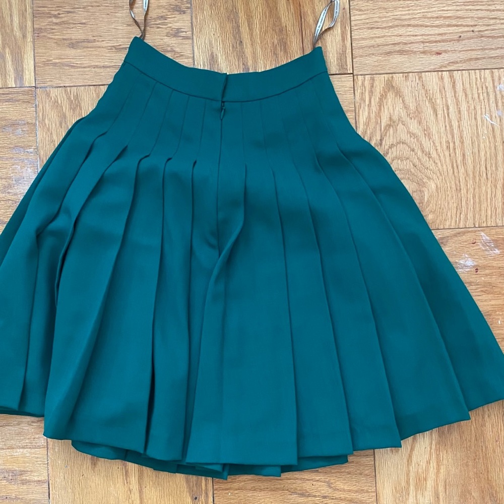Green pleated skirt